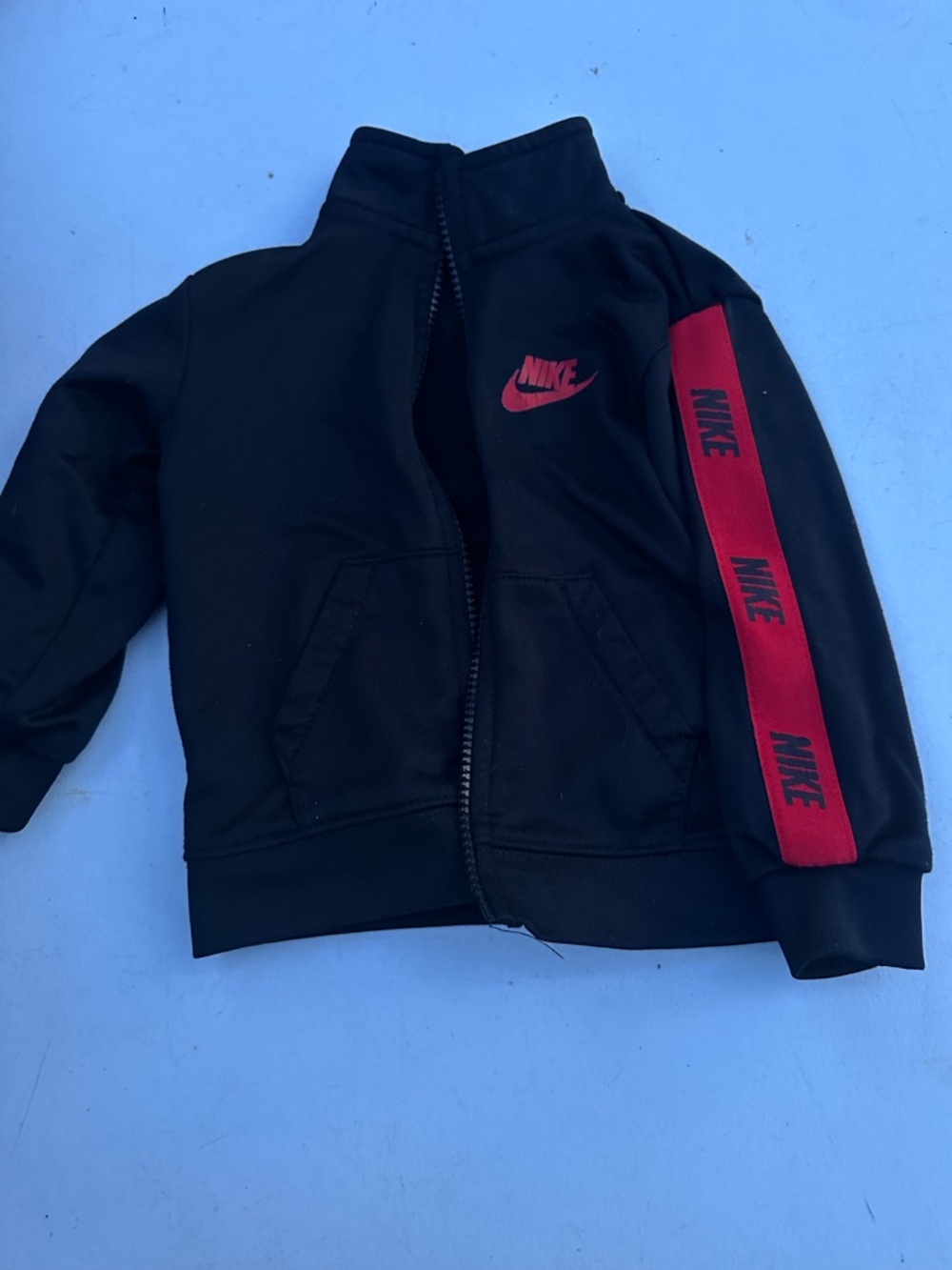Nike Black Jacket with Red Swoosh and Sleeve Tape